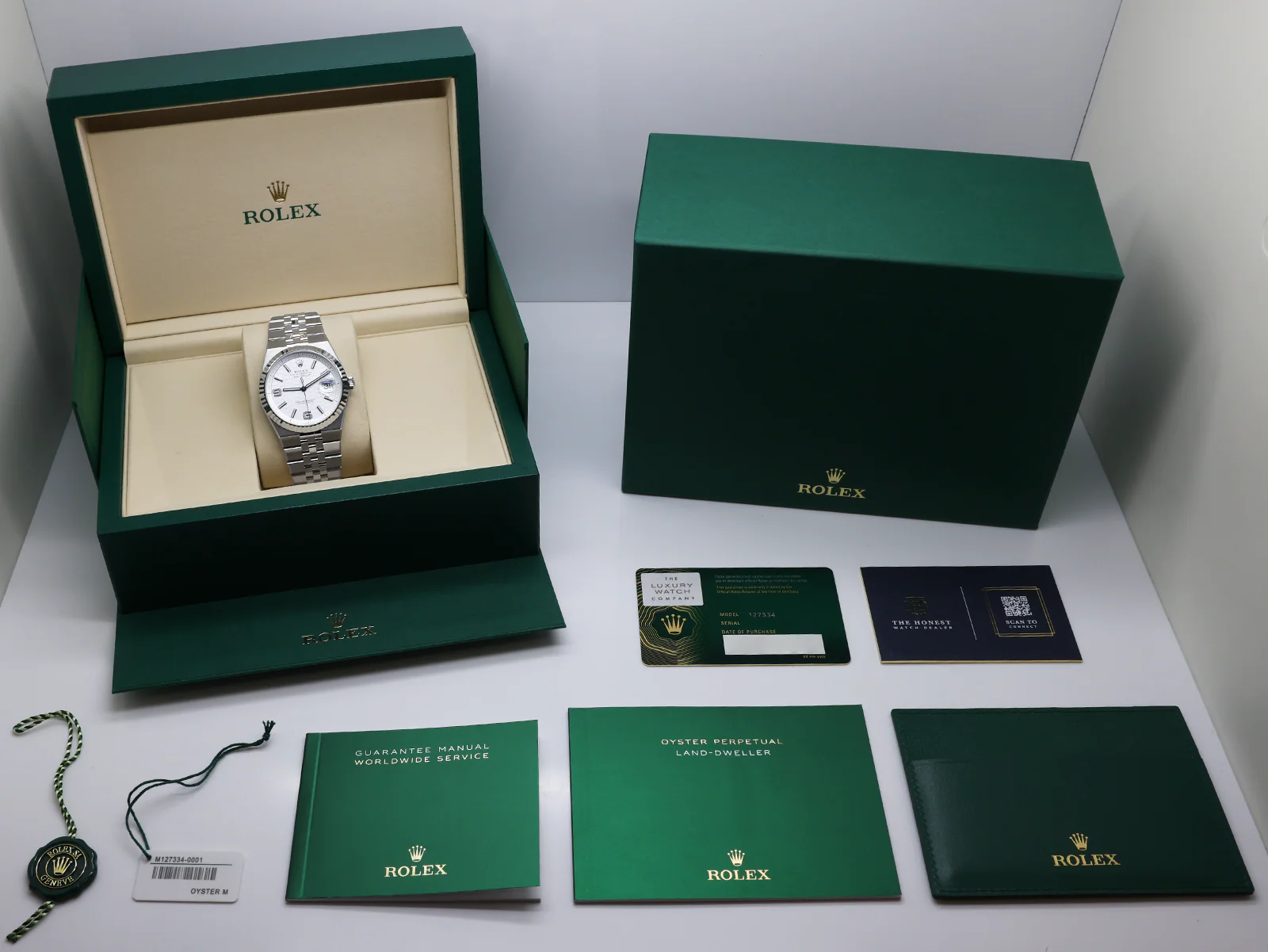 Rolex Land-Dweller 127334 40mm Stainless Steel White Honeycomb Dial – Unworn 2026 Full Set 7 Rolex Land-Dweller 127334 stainless steel case side