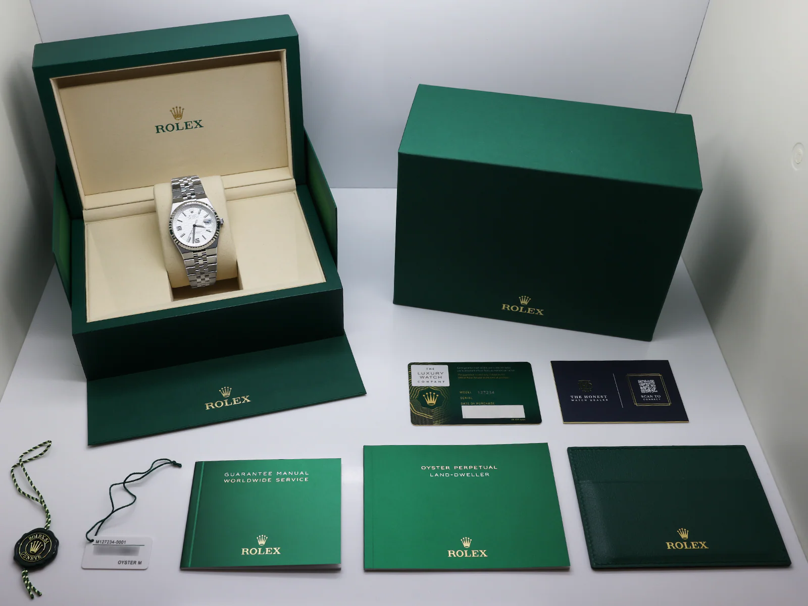 Rolex Land-Dweller 36 White Dial 127234 Stainless Steel Fluted Bezel – 2025 Box & Papers 10 Rolex Land Dweller 127234 angled view