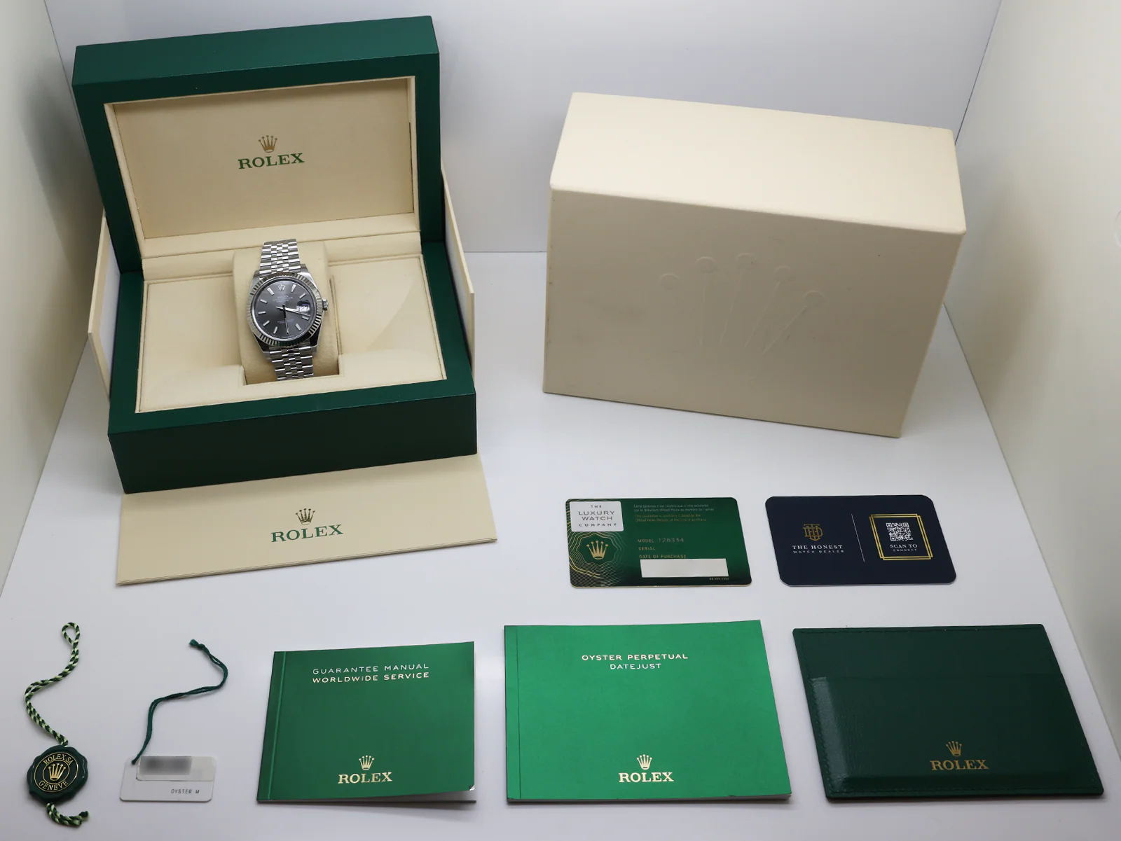 Rolex Land-Dweller 127234 36mm Stainless Steel White Honeycomb Dial – Unworn 2026 Box & Papers 10 Rolex Land Dweller 127234 angled dial view